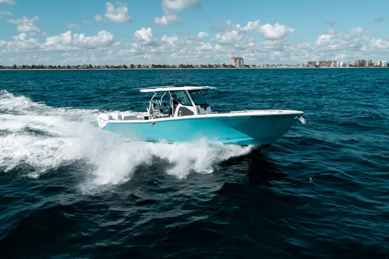  Yacht Photos Pics 2020 Blackfin 332 CC boat cruising on open water under a clear sky.