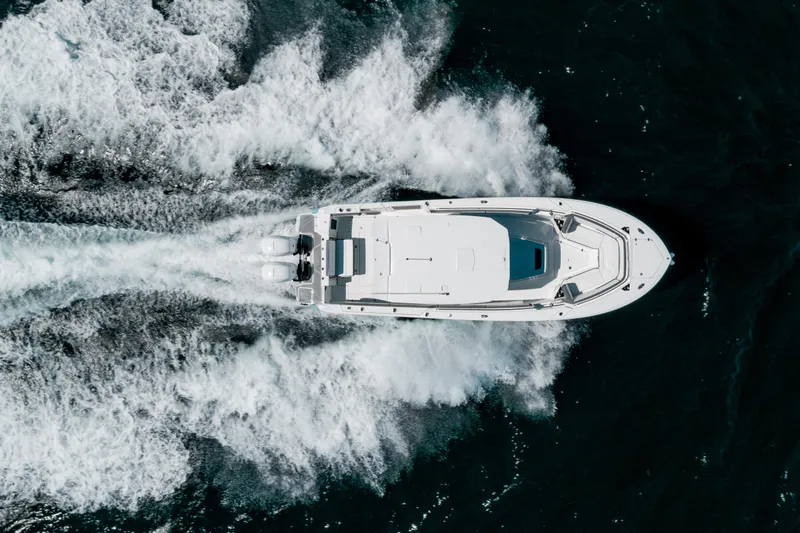  Yacht Photos Pics Aerial view of 2020 Blackfin 332 CC boat cruising on open water.