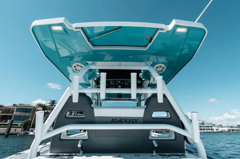  Yacht Photos Pics 2020 Blackfin 332 CC boat with sleek design and modern features on the water.