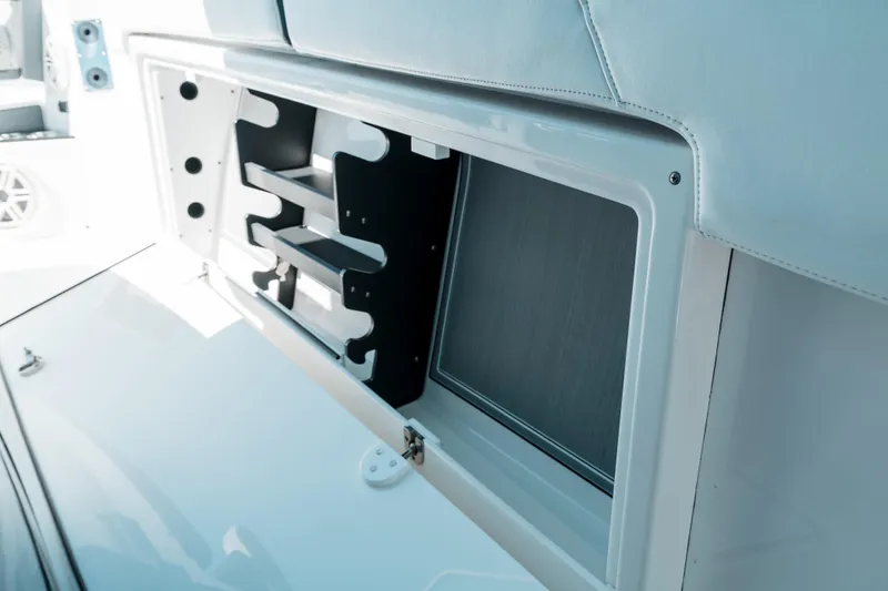  Yacht Photos Pics 2020 Blackfin 332 CC boat storage compartment with sleek design and organized shelving.