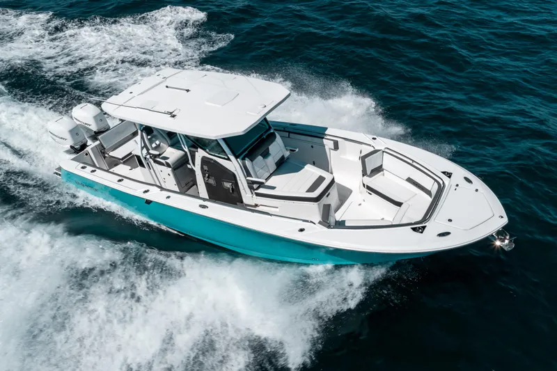  Yacht Photos Pics 2020 Blackfin 332 CC boat cruising on open water, showcasing sleek design and powerful performance.