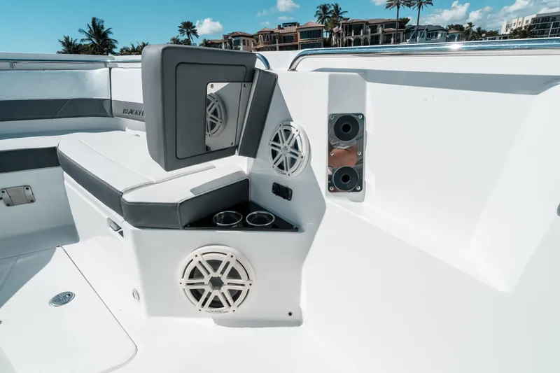  Yacht Photos Pics 2020 Blackfin 332 CC boat interior with seating, speakers, and cup holders.