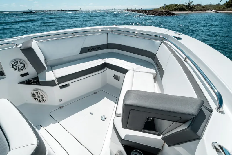  Yacht Photos Pics 2020 Blackfin 332 CC boat interior with cushioned seating and ocean view.