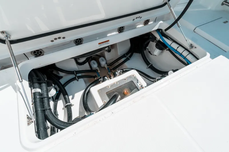  Yacht Photos Pics 2020 Blackfin 332 CC boat compartment with visible wiring and components.
