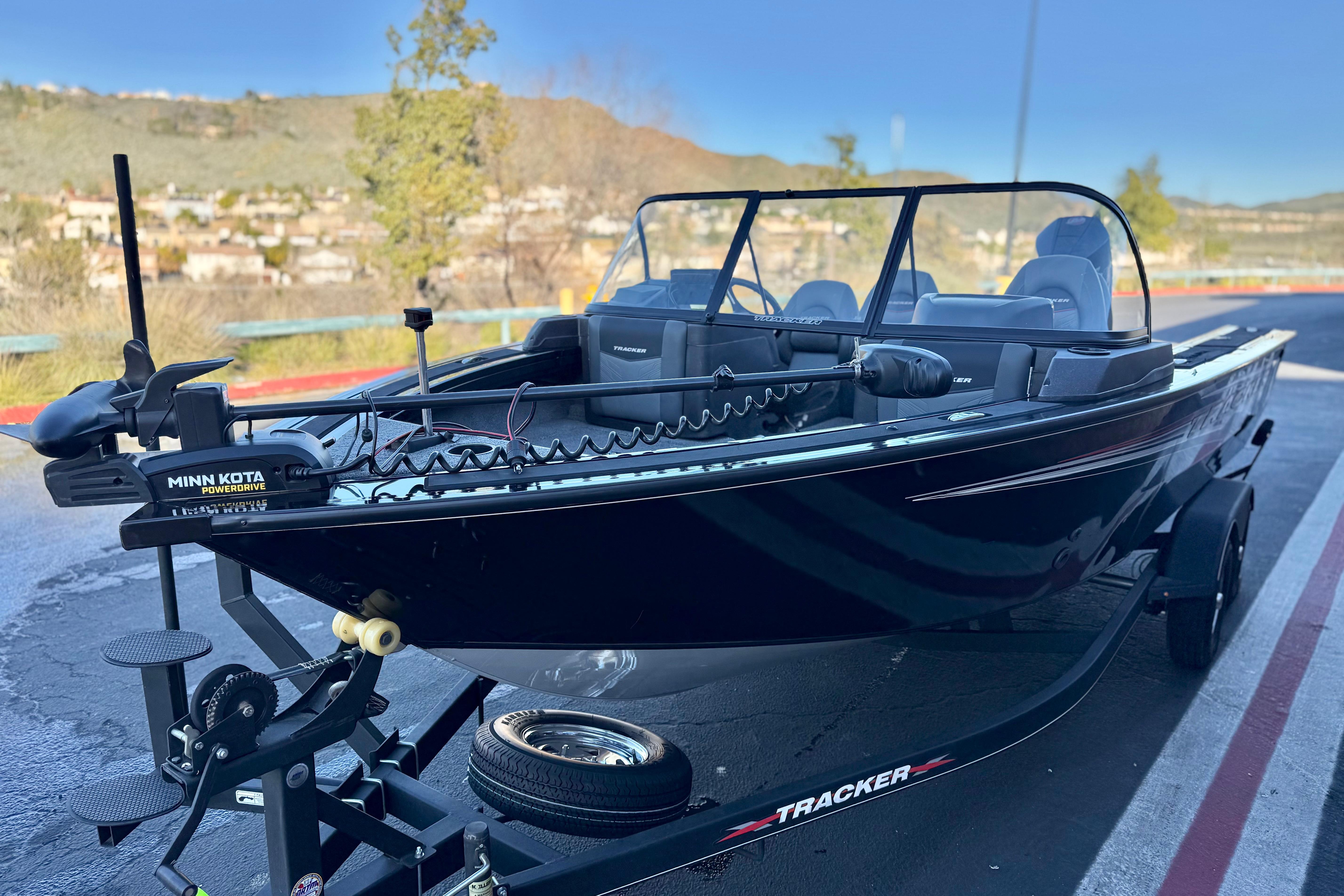 2023 Tracker Targa V-19 WT boat on trailer, featuring Minn Kota PowerDrive motor.