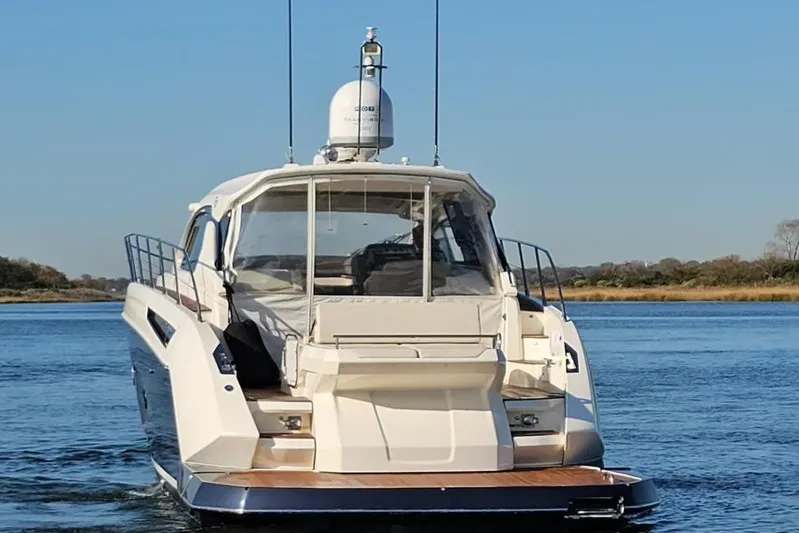  Yacht Photos Pics Azimut Atlantis 50 yacht, 2015 model, cruising on a calm blue waterway.