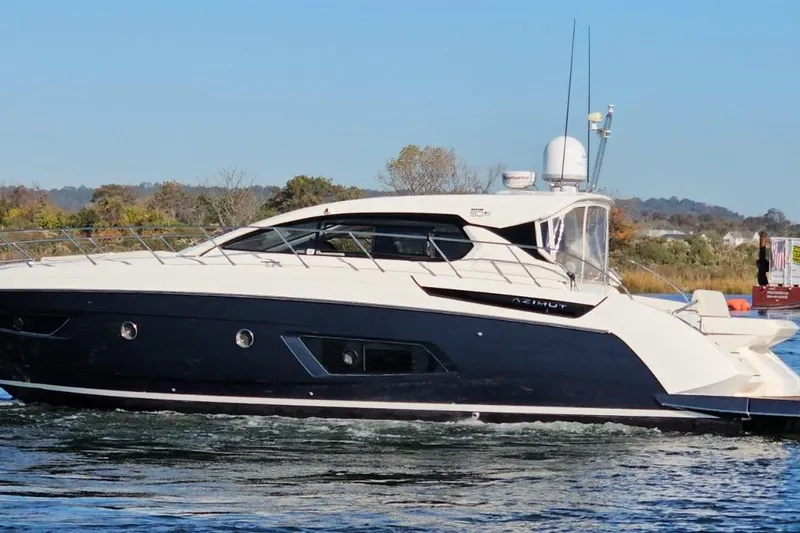  Yacht Photos Pics 2015 Azimut Atlantis 50 yacht cruising on a calm waterway.