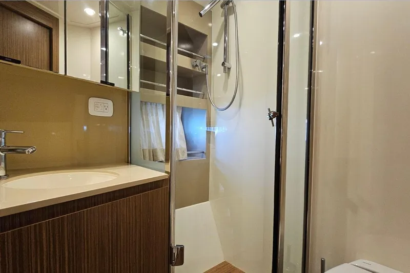  Yacht Photos Pics Luxurious bathroom in 2015 Azimut Atlantis 50 yacht with modern fixtures and shower.