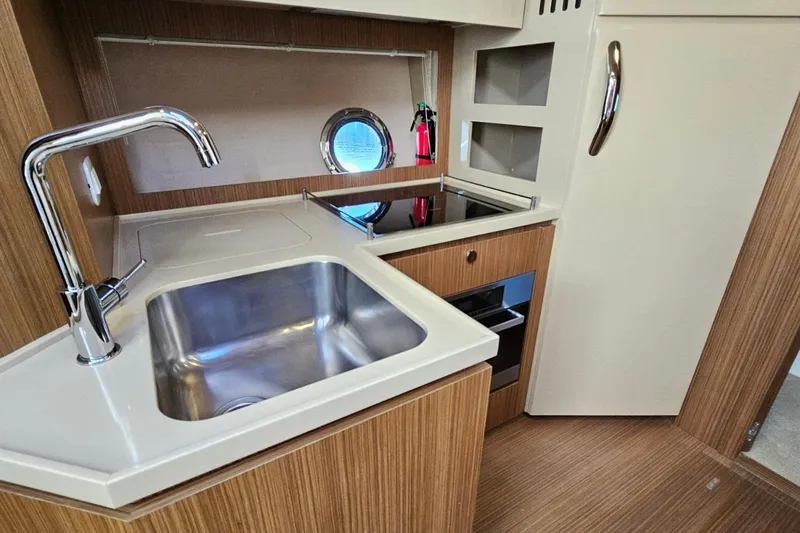  Yacht Photos Pics Modern kitchen area in 2015 Azimut Atlantis 50 yacht with sink and stove.