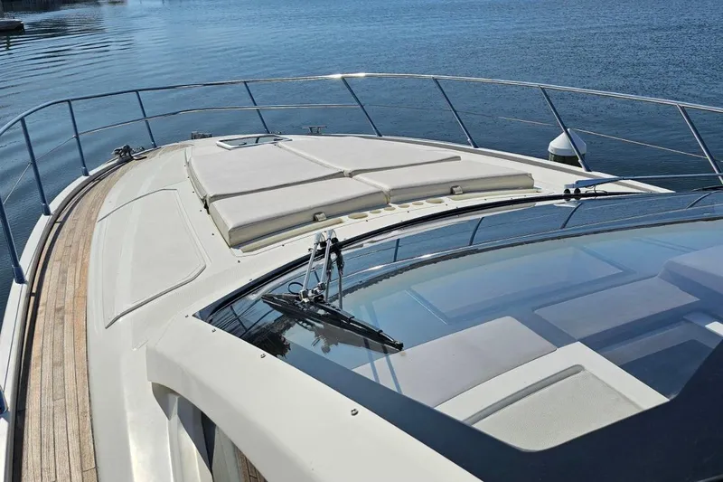  Yacht Photos Pics 2015 Azimut Atlantis 50 yacht deck with sunbathing area, overlooking calm waters.