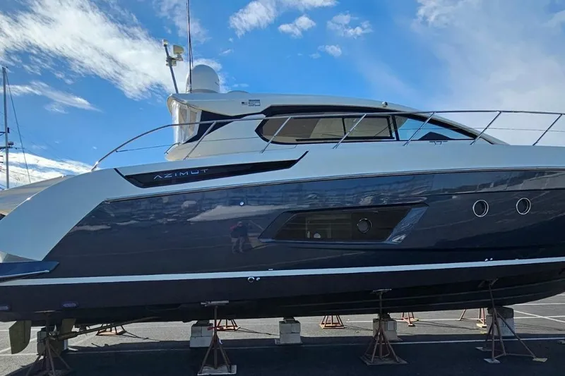  Yacht Photos Pics Azimut Atlantis 50 yacht, 2015 model, displayed on stands under a clear blue sky.