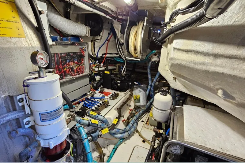  Yacht Photos Pics Engine room of a 2015 Azimut Atlantis 50 yacht, showcasing complex machinery and wiring.
