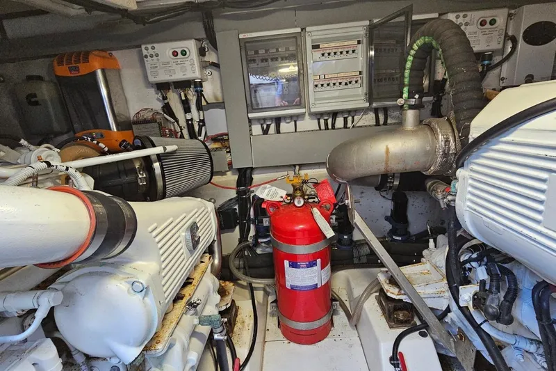  Yacht Photos Pics Engine room of 2015 Azimut Atlantis 50 yacht with fire extinguisher and control panels.