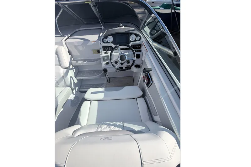  Yacht Photos Pics 2019 Regal 28 Express boat cockpit with steering wheel and control panel.