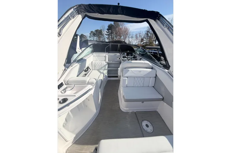  Yacht Photos Pics 2019 Regal 28 Express boat interior with white seating and modern dashboard.