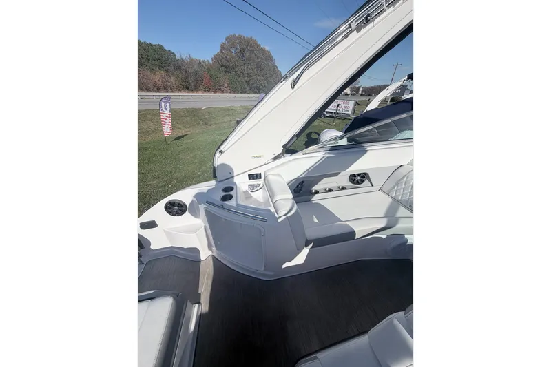  Yacht Photos Pics 2019 Regal 28 Express boat interior with white seating and control panel.
