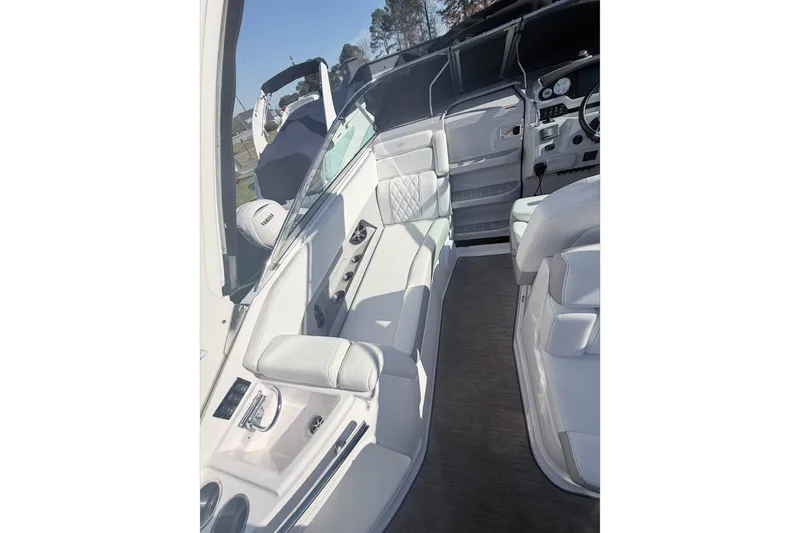  Yacht Photos Pics 2019 Regal 28 Express boat interior with white seating and modern dashboard.