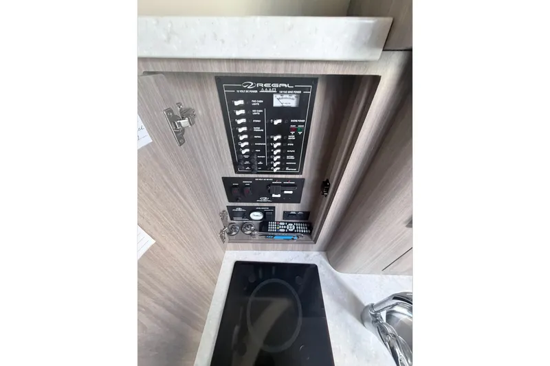  Yacht Photos Pics Control panel of a 2019 Regal 28 Express boat interior.