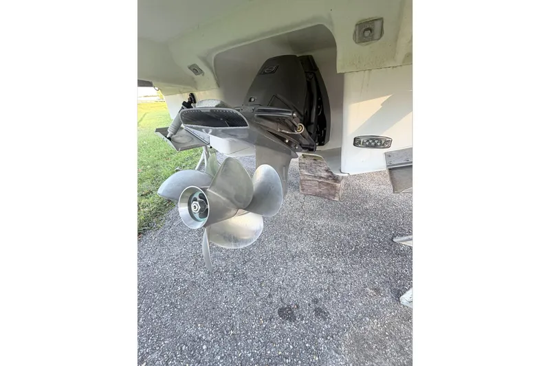  Yacht Photos Pics 2019 Regal 28 Express boat propeller and stern drive on pavement.