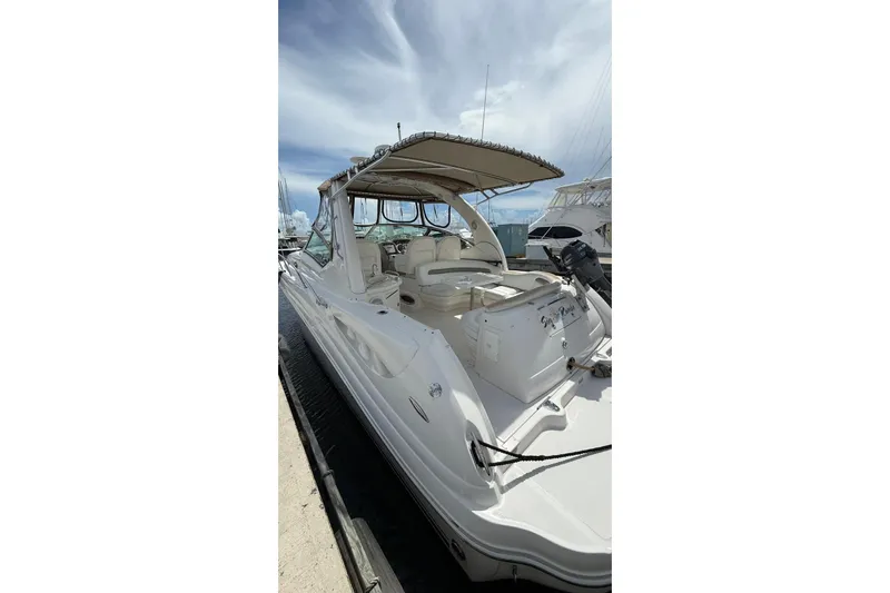  Yacht Photos Pics 2006 Sea Ray 340 Sundancer yacht docked under a clear sky.