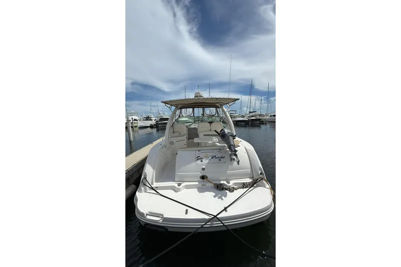  Yacht Photos Pics 2006 Sea Ray 340 Sundancer docked at marina under blue sky.