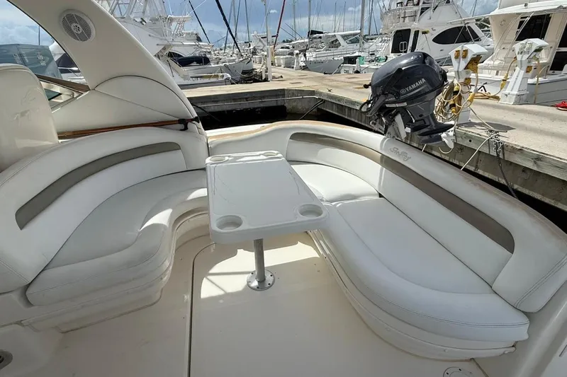  Yacht Photos Pics 2006 Sea Ray 340 Sundancer boat interior with white seating and table at marina.