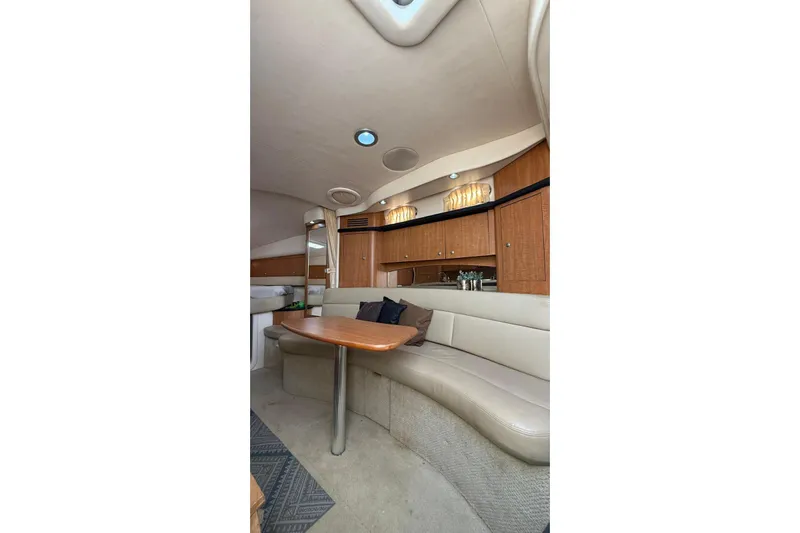  Yacht Photos Pics Interior of 2006 Sea Ray 340 Sundancer yacht with elegant seating and wooden cabinetry.