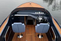 2024 Frauscher 858 Fantom boat interior with sleek dashboard and dual blue seats.