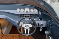 2024 Frauscher 858 Fantom boat dashboard with steering wheel and gauges.