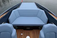 2024 Frauscher 858 Fantom boat interior with blue seating and wooden deck.