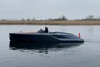 2024 Frauscher 858 Fantom luxury boat on calm water, side view.