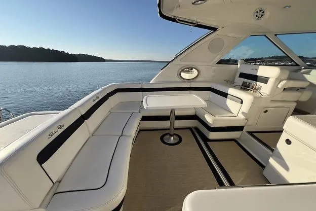  Yacht Photos Pics Luxurious 2010 Sea Ray 450 Sundancer yacht interior with elegant seating and scenic water view.
