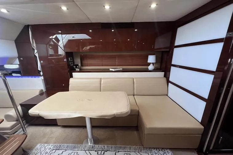  Yacht Photos Pics Luxurious interior of 2010 Sea Ray 450 Sundancer yacht with beige seating and modern decor.