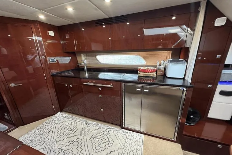  Yacht Photos Pics Luxurious kitchen interior of 2010 Sea Ray 450 Sundancer yacht with modern amenities.