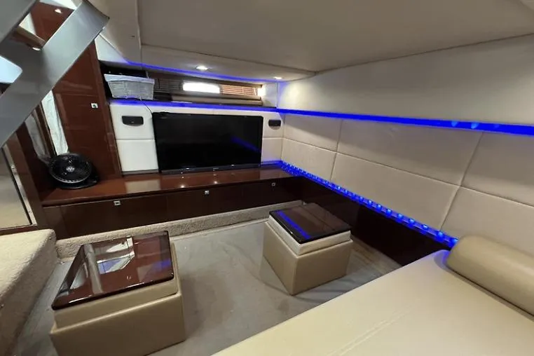  Yacht Photos Pics Luxurious interior of 2010 Sea Ray 450 Sundancer yacht with modern seating and ambient lighting.