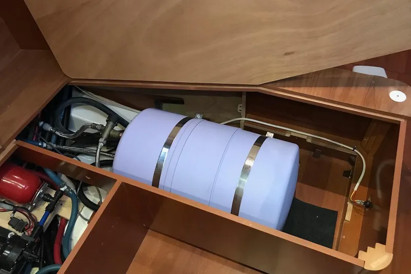 At Last Yacht Photos Pics Interior view of 2012 Beneteau Oceanis 45 yacht showing storage compartment and equipment.