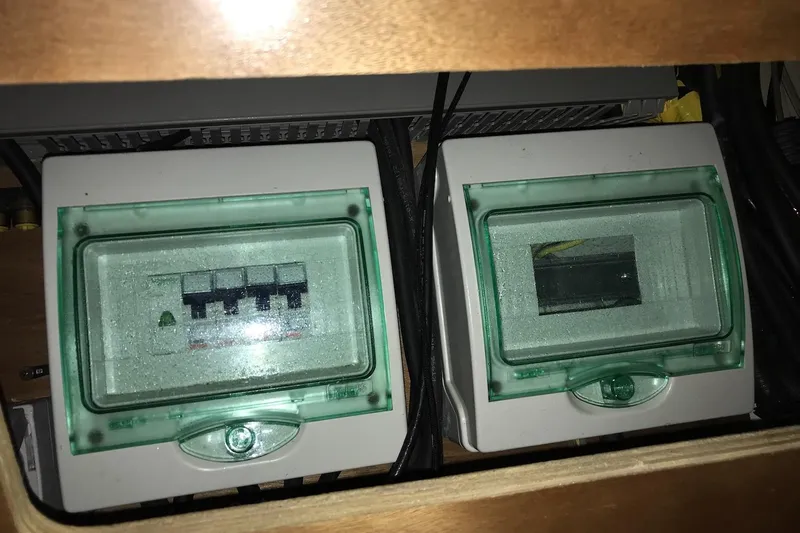 At Last Yacht Photos Pics Electrical panel on a 2012 Beneteau Oceanis 45 sailboat, featuring circuit breakers.