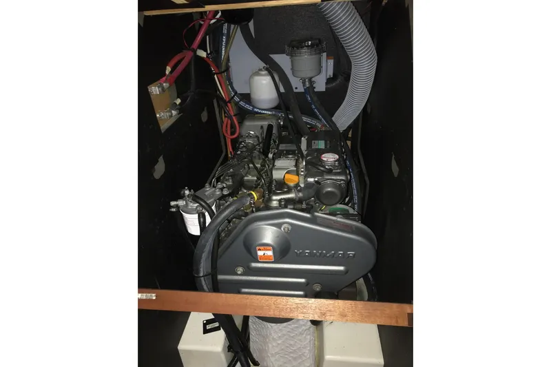At Last Yacht Photos Pics Engine compartment of a 2012 Beneteau Oceanis 45 sailboat, featuring a Yanmar engine.