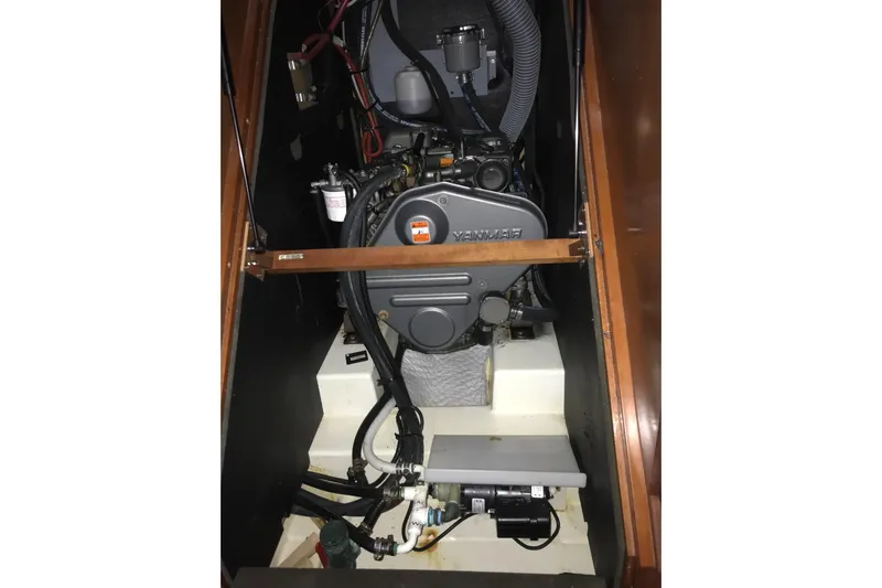 At Last Yacht Photos Pics Engine compartment of a 2012 Beneteau Oceanis 45 sailboat, featuring a Yanmar engine.