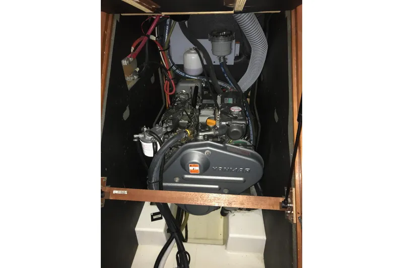 At Last Yacht Photos Pics Engine compartment of a 2012 Beneteau Oceanis 45 sailboat, featuring a Yanmar engine.