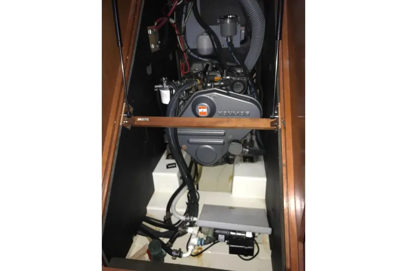 At Last Yacht Photos Pics Engine compartment of a 2012 Beneteau Oceanis 45 sailboat, featuring a Yanmar engine.