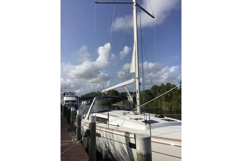 At Last Yacht Photos Pics 2012 Beneteau Oceanis 45 sailboat docked under a clear blue sky.