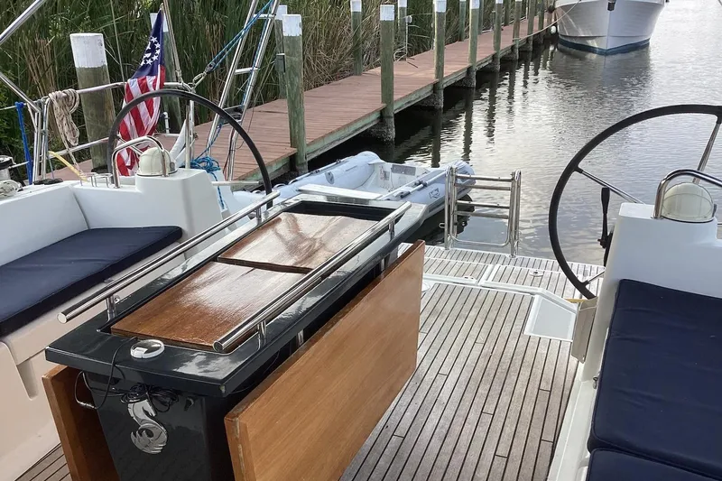 At Last Yacht Photos Pics Beneteau Oceanis 45 sailboat cockpit with dual steering wheels, docked at a marina, 2012 model.