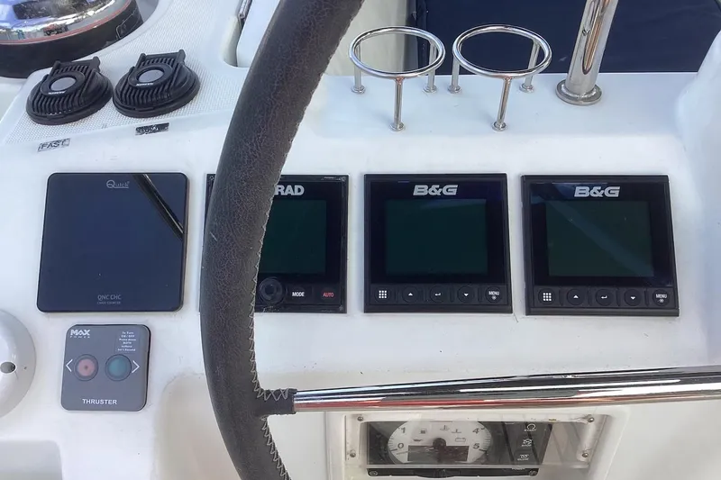 At Last Yacht Photos Pics Control panel of a 2012 Beneteau Oceanis 45 sailboat with navigation instruments.