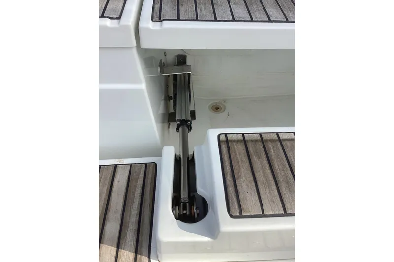 At Last Yacht Photos Pics Beneteau Oceanis 45 (2012) yacht deck with wooden finish and metal hinge detail.