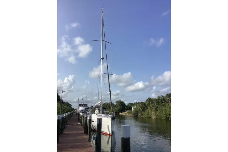 At Last Yacht Photos Pics Sailboat Beneteau Oceanis 45, 2012 model, docked on a sunny day with blue sky.