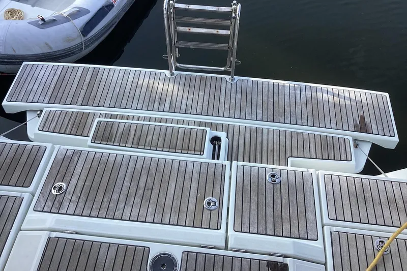At Last Yacht Photos Pics Beneteau Oceanis 45 (2012) yacht deck with wooden finish and ladder.