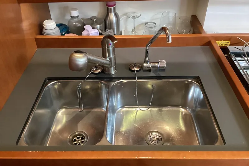 At Last Yacht Photos Pics Stainless steel double sink in 2012 Beneteau Oceanis 45 yacht kitchen.