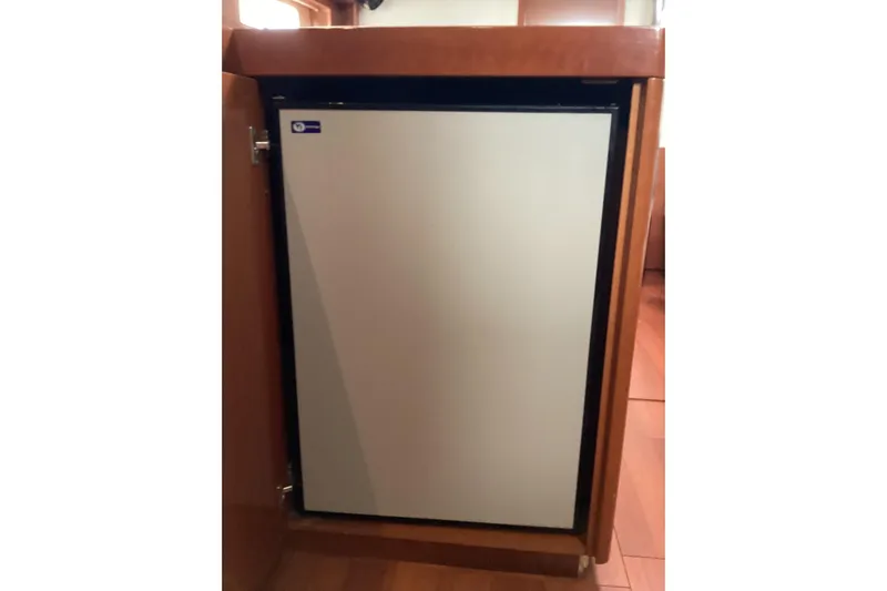 At Last Yacht Photos Pics Compact refrigerator in 2012 Beneteau Oceanis 45 yacht interior.