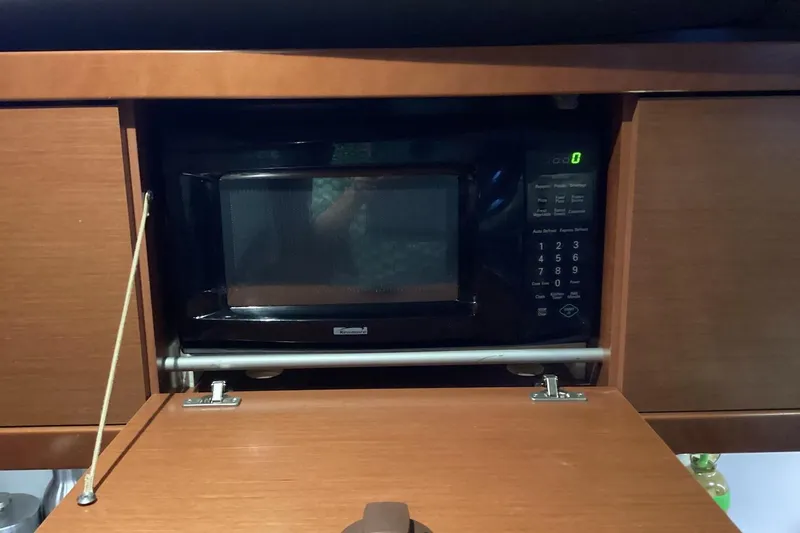 At Last Yacht Photos Pics Microwave in 2012 Beneteau Oceanis 45 yacht kitchen cabinet.